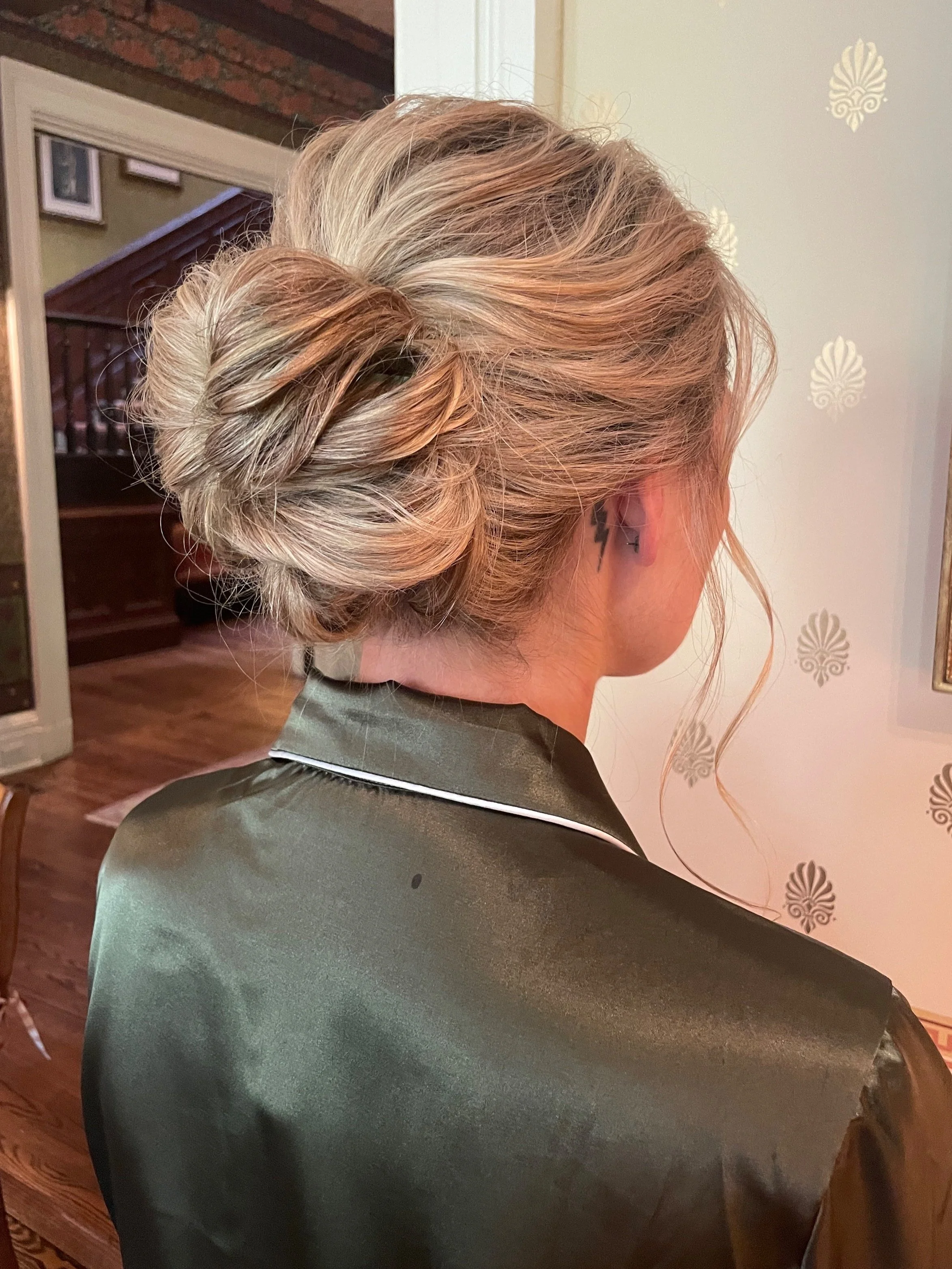 Classic bridal updo with curled face framing pieces by Maryland hair and makeup artist.