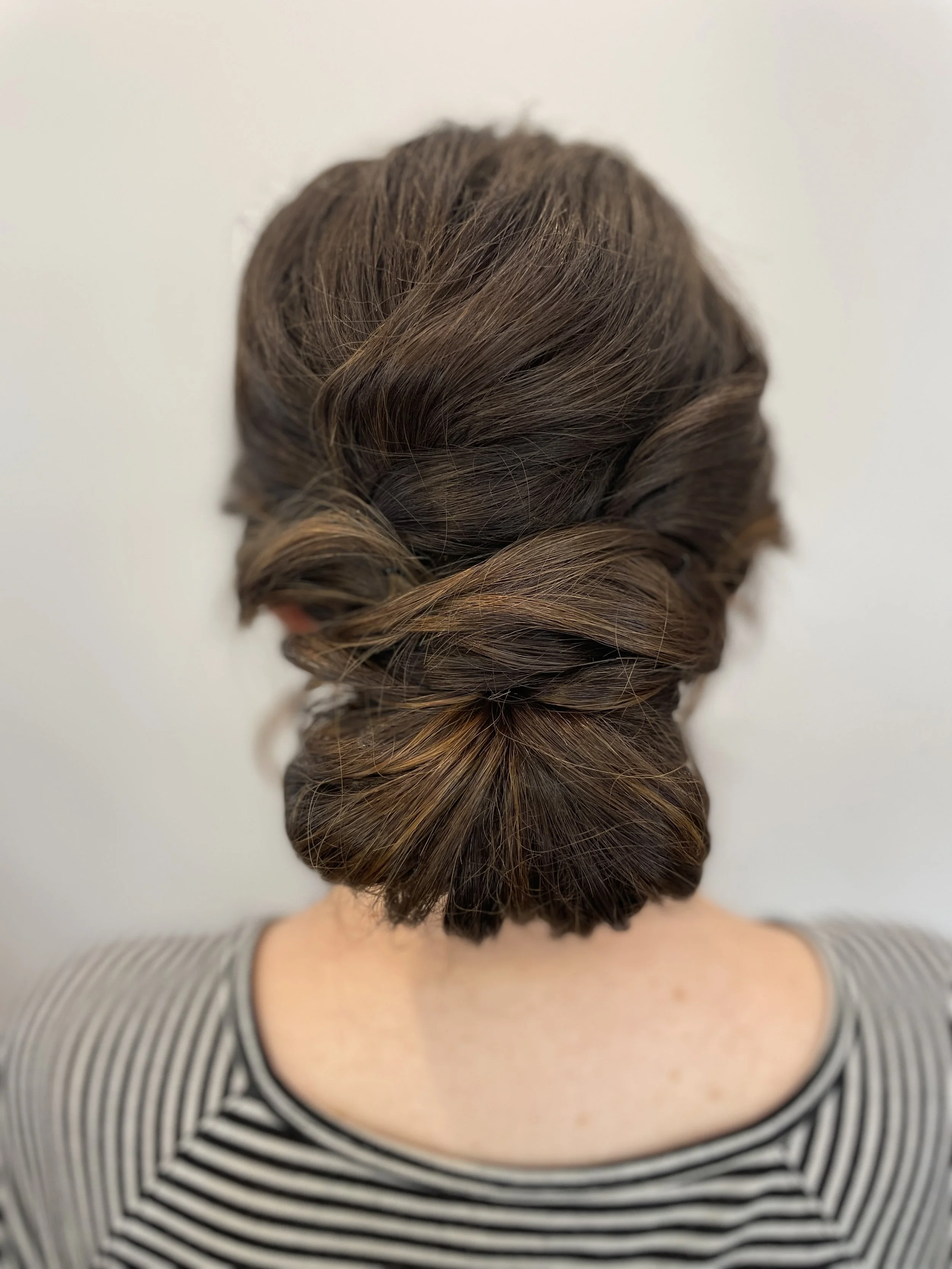 Natural low bridal bun styled with depth and dimension for Maryland wedding