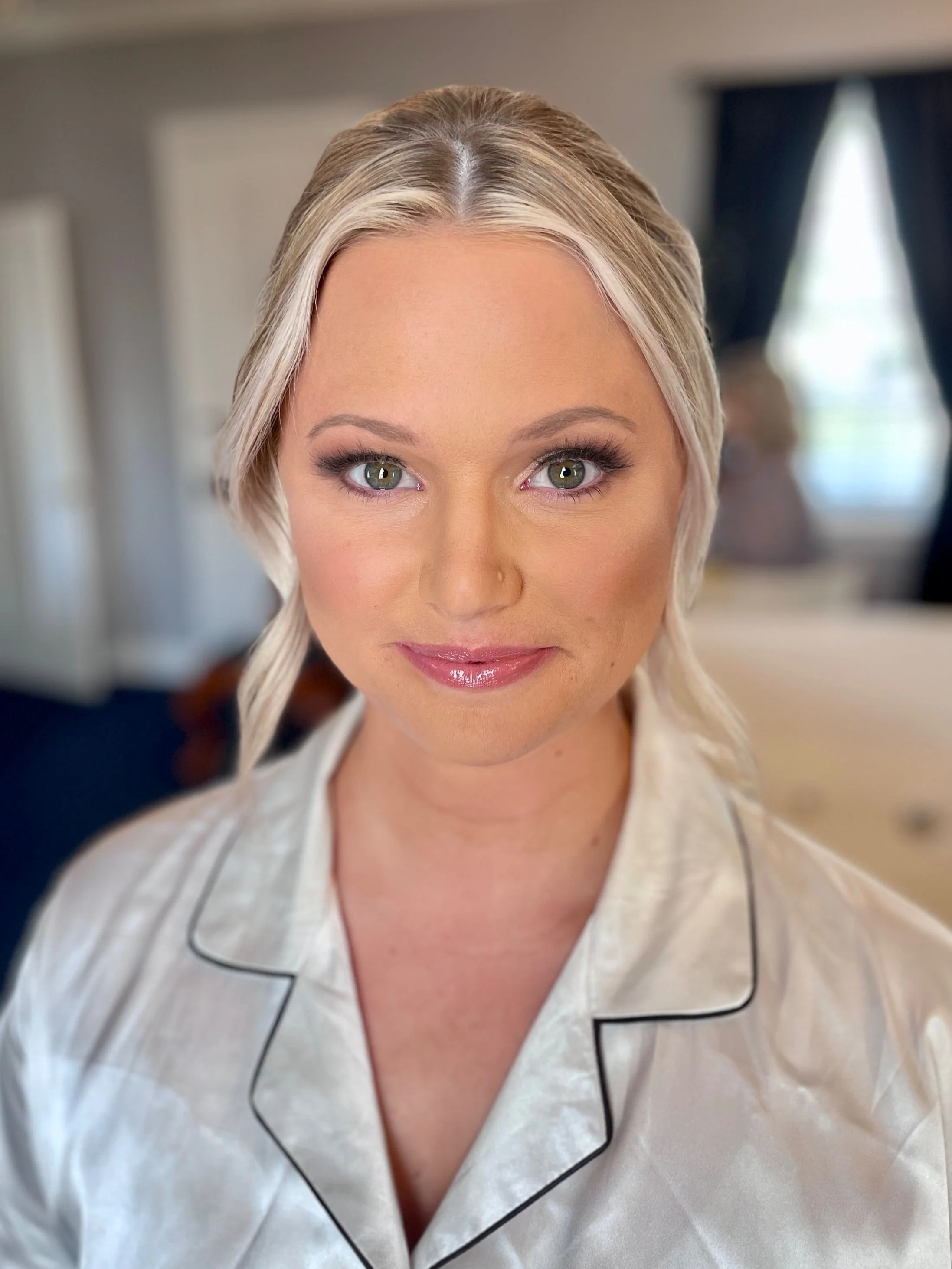 Fresh bridal makeup highlighting luminous complexion and soft shimmering eyes in Frederick Maryland