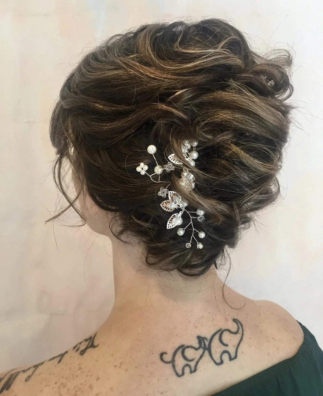 Modern textured updo for Maryland bride with silver and pearl hair accessory