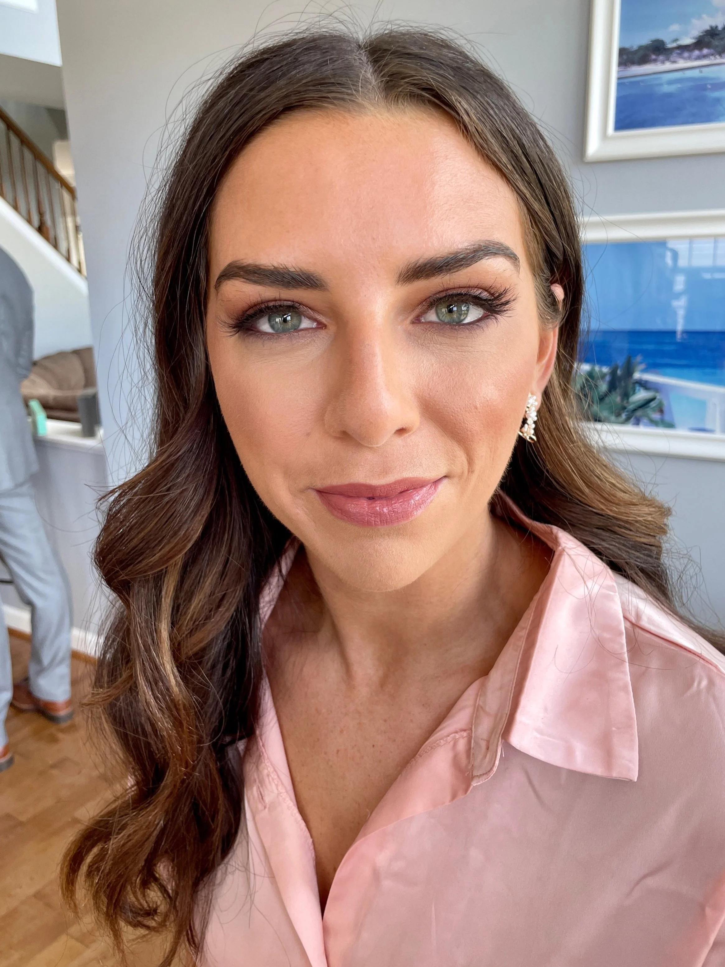 soft timeless bridal makeup for green eyes featuring tones of pink and soft lashes