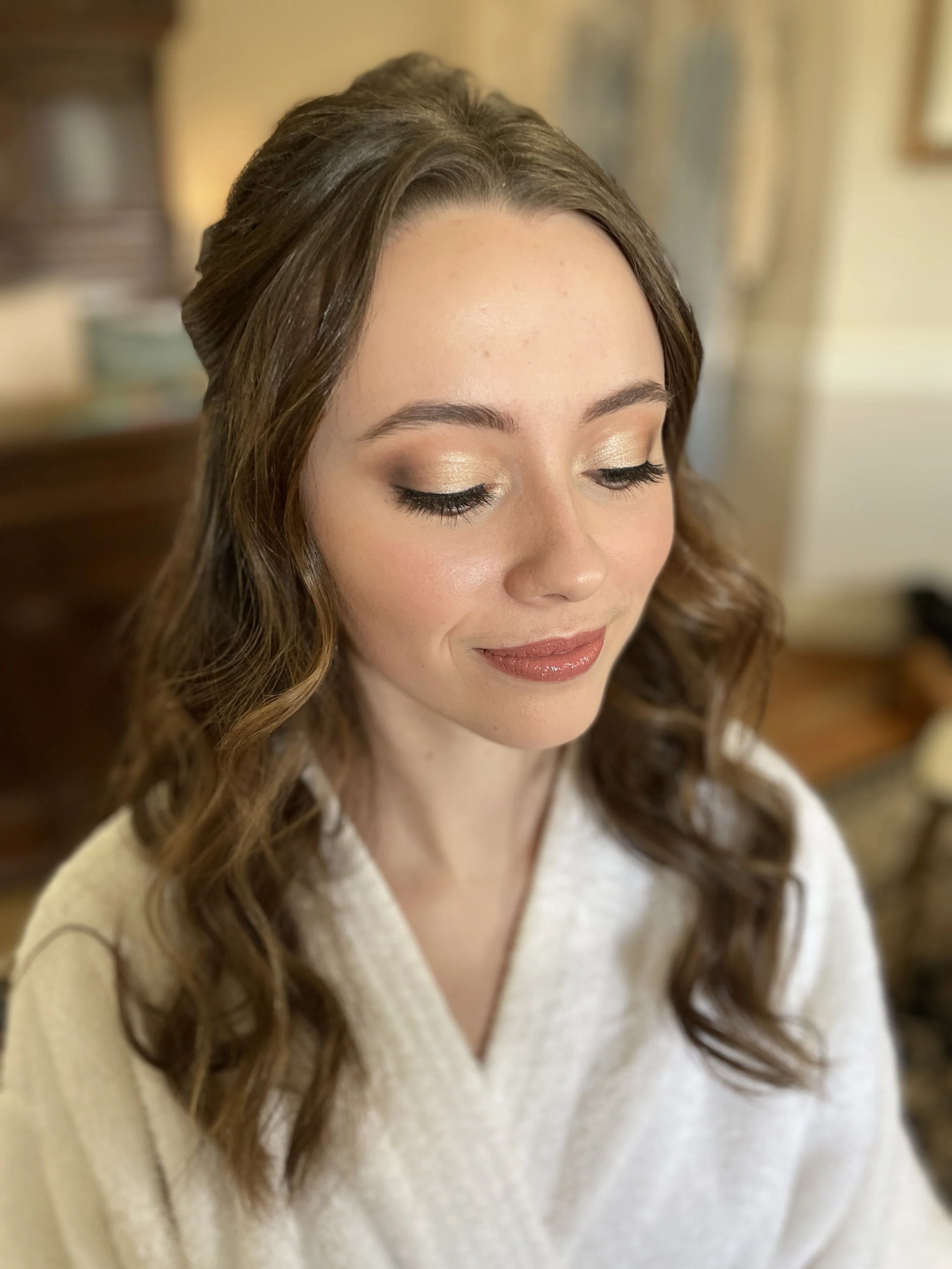Elegant natural wedding makeup with light shimmer eyeshadow and polished glossed lip