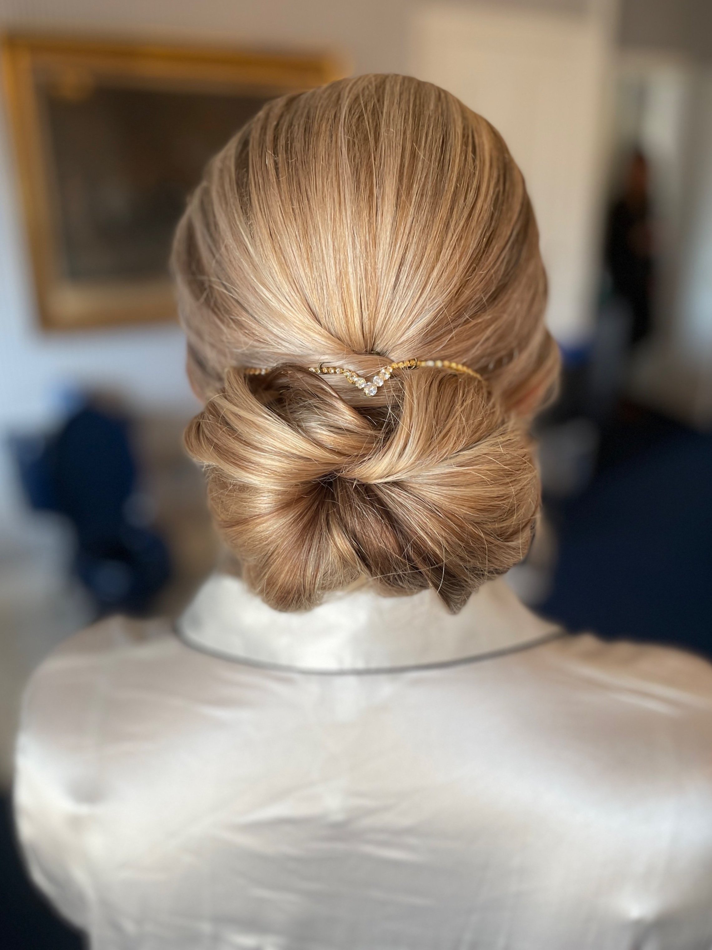 Unique but classic bun bridal hairstyle with airy texture for Maryland wedding
