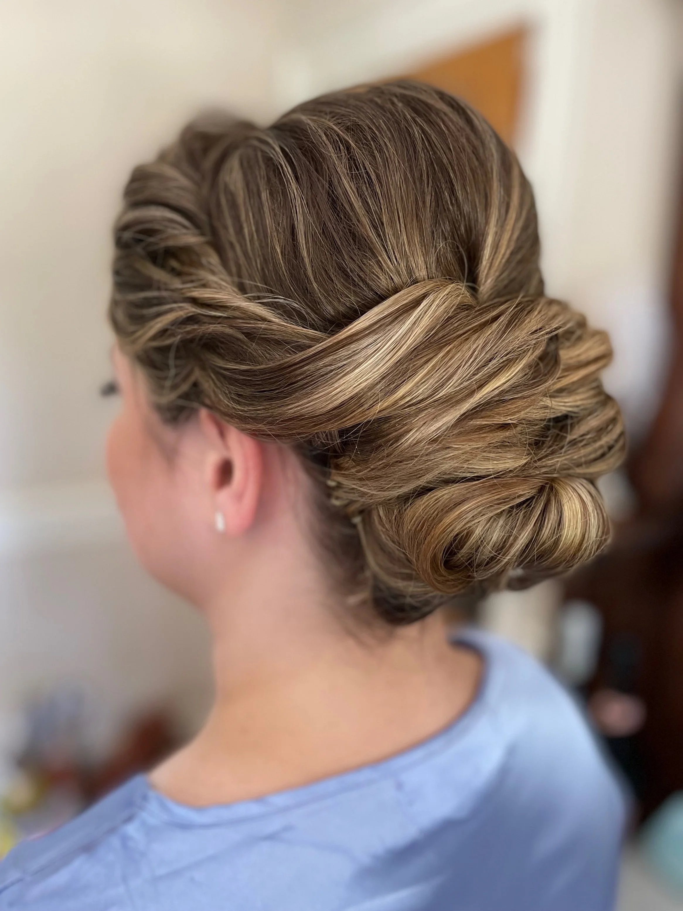 Textured low bun bridal hairstyle for Maryland bride with natural dimension