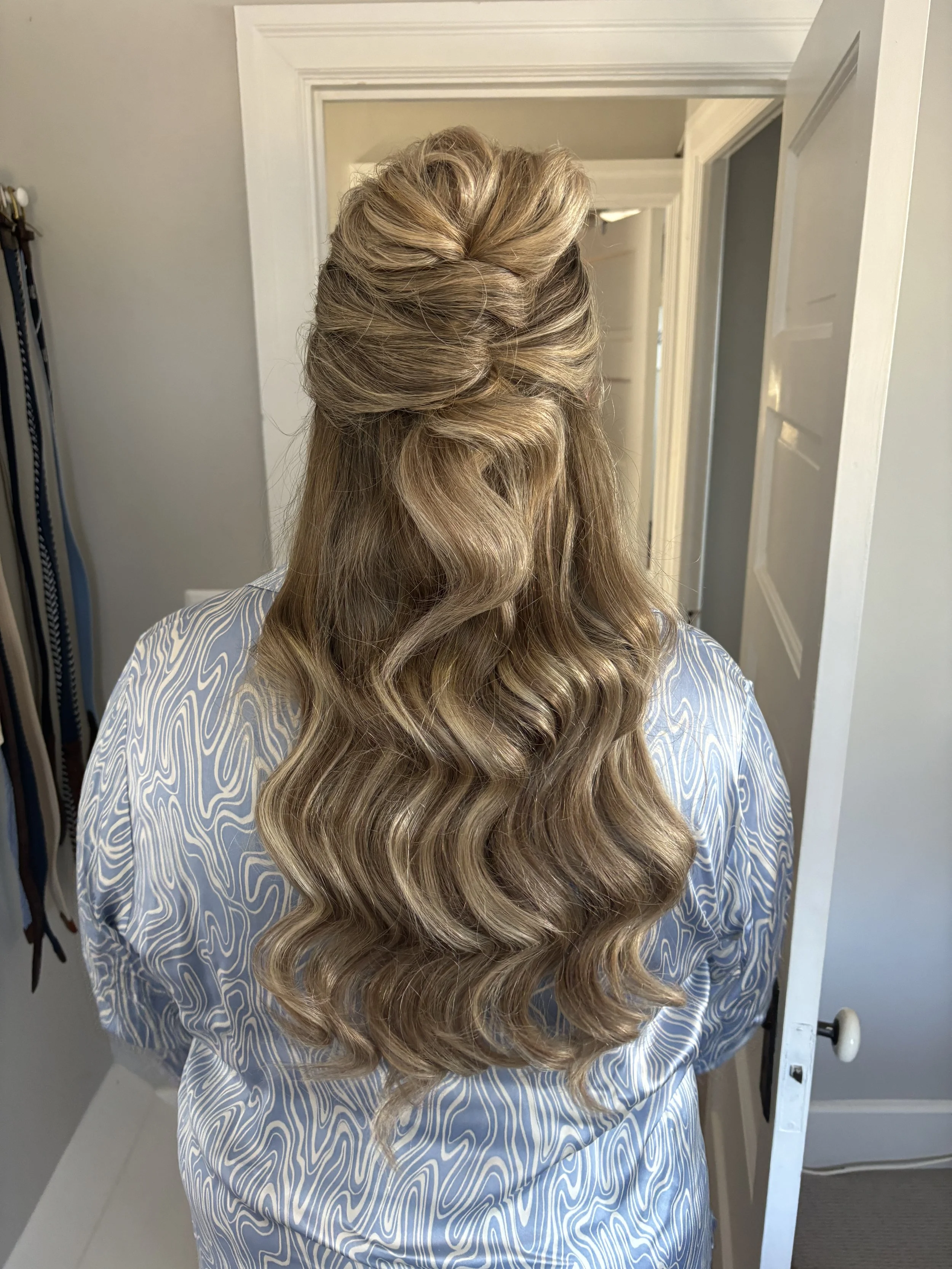 Half up half down bridal hairstyle by Frederick MD wedding hair artist with soft crown volume