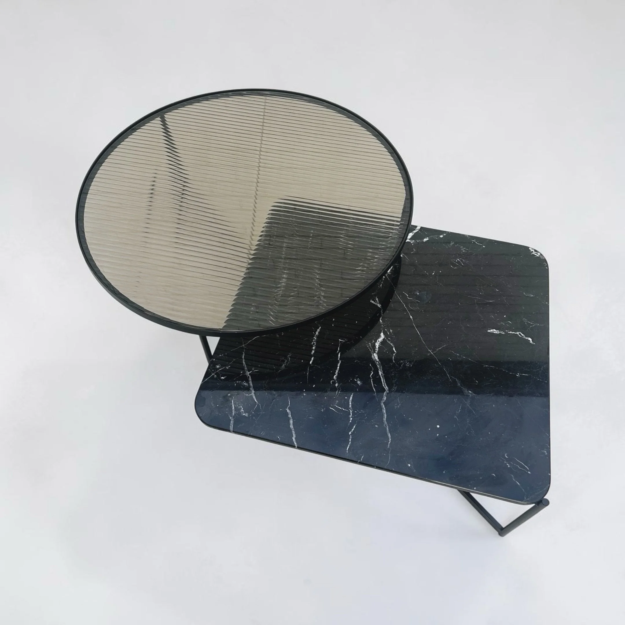 Another unexpected thrift find&mdash; this time in glass, steel, and marble. This is the Mahana Coffee Table, designed by Tom Rundle in 2017 under the SPO1 label. It was manufactured in Italy, ensuring the piece was crafted by the same Italian artisa