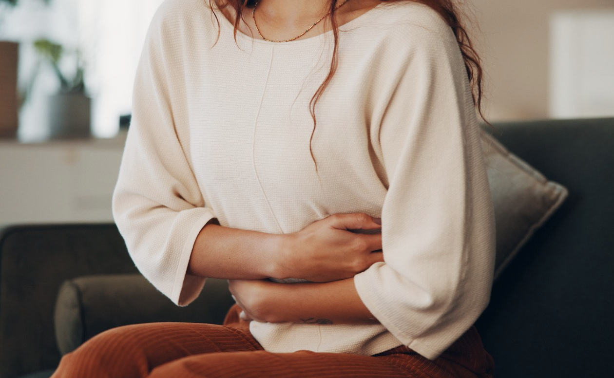 Person holding stomach