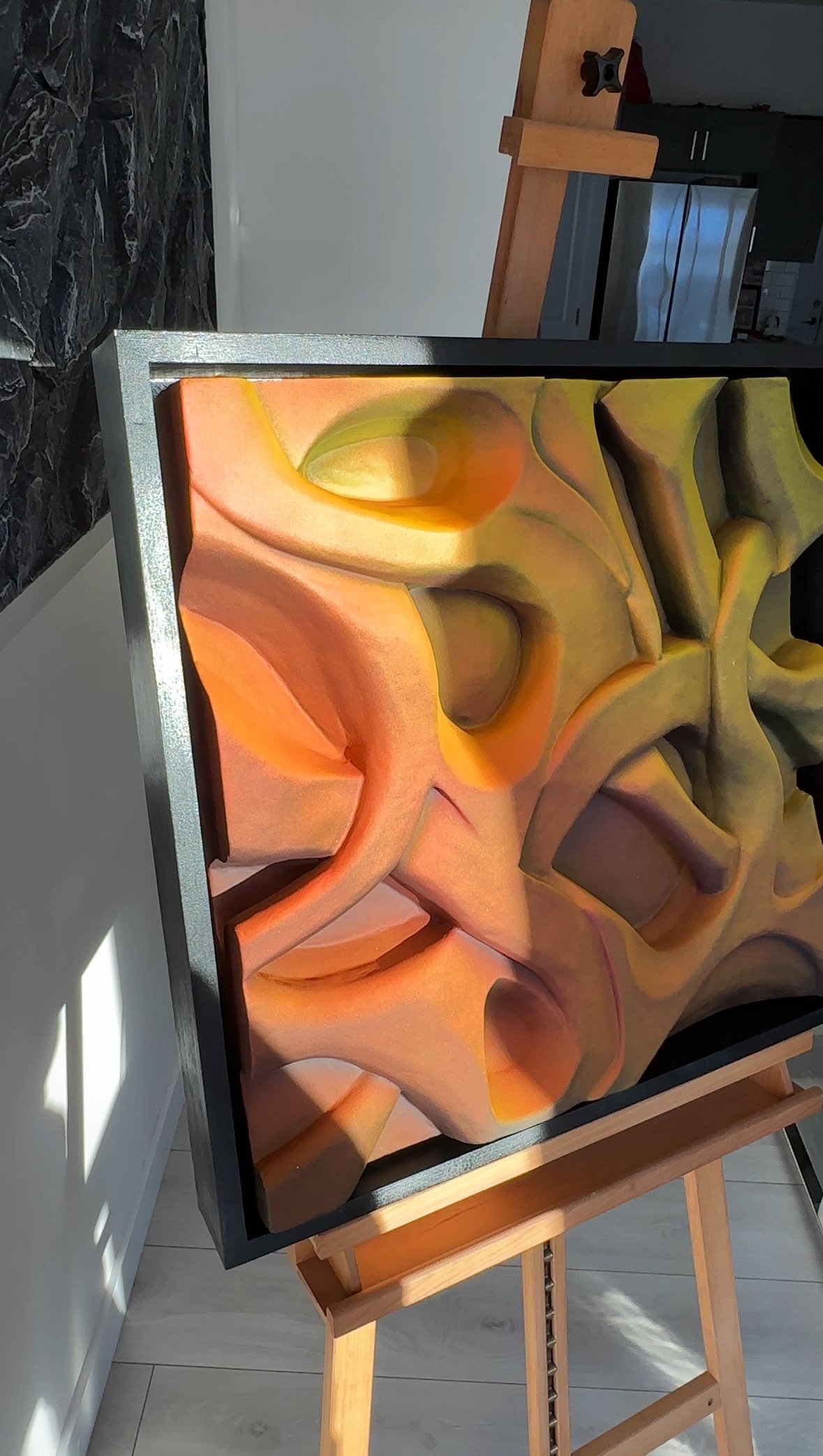 Colorful abstract 3D artwork on an easel