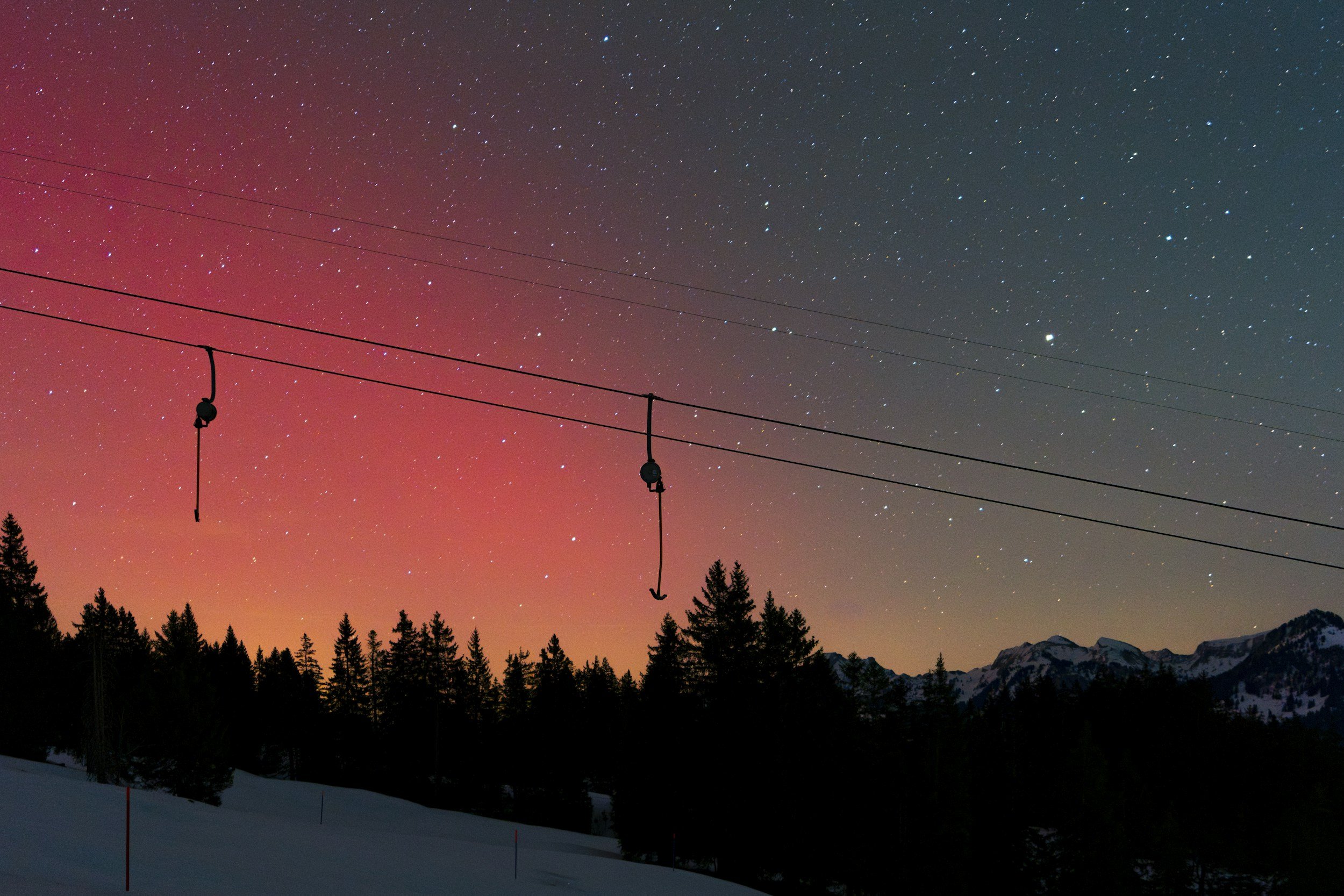 Ski lift in the distance, midnight sun