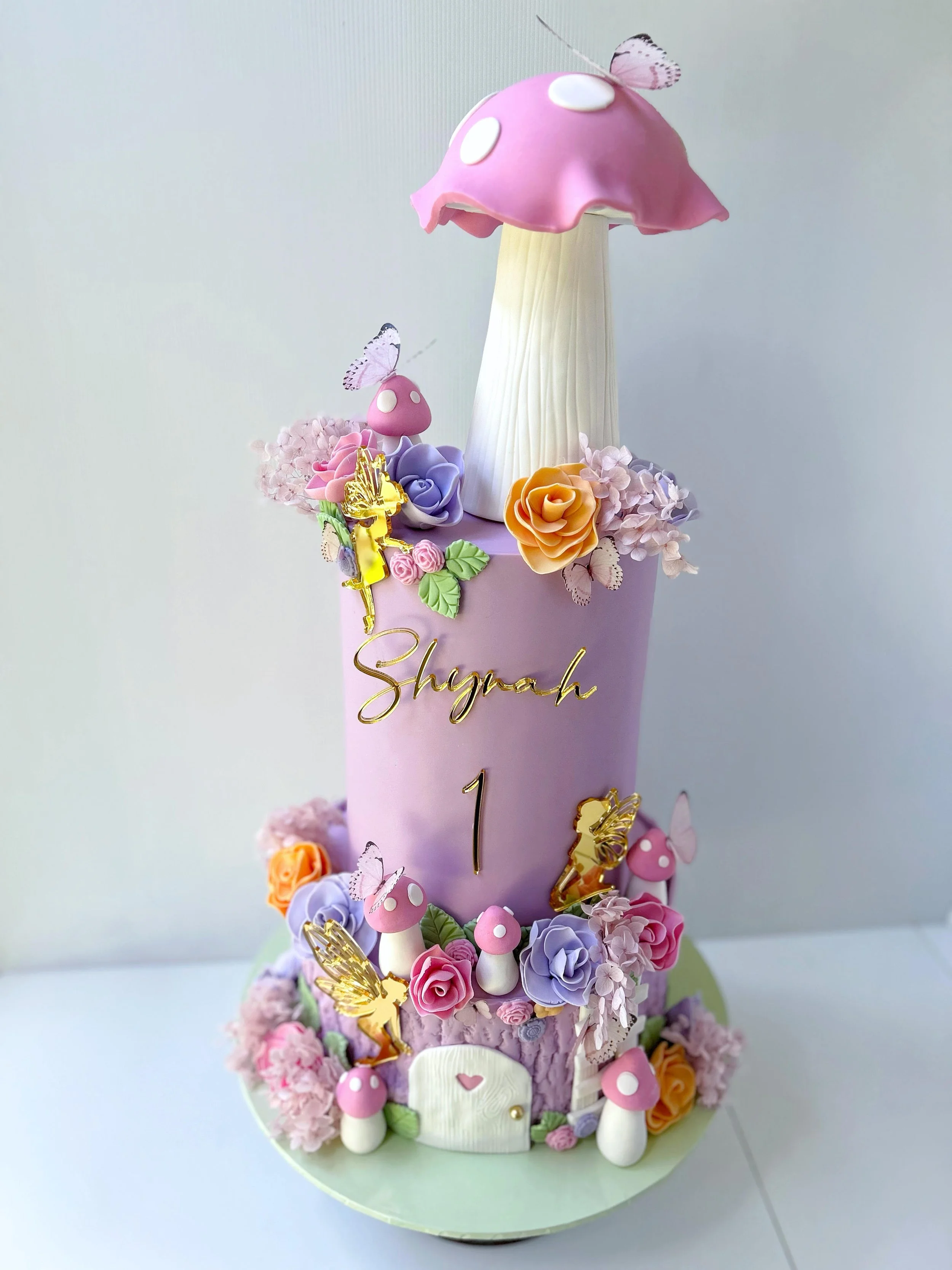 Enchanted Fairy Garden with butterflies and mushroom hut