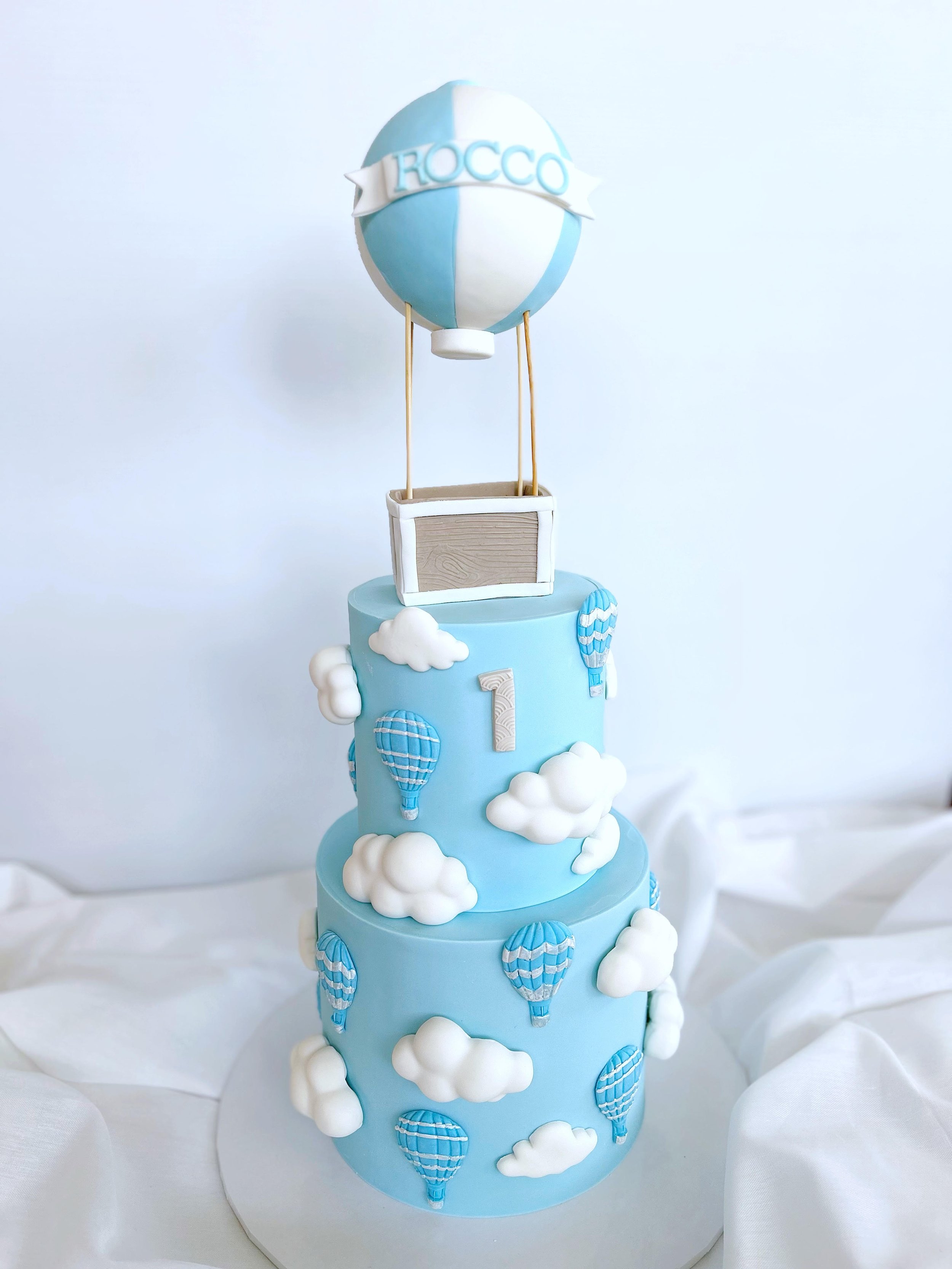 First Birthday boy cake, decorated with hot air baloons and 3D clouds