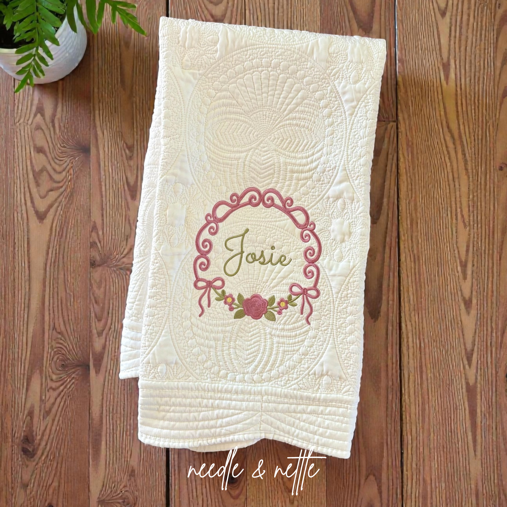 Flay lay embroidered quilt.png