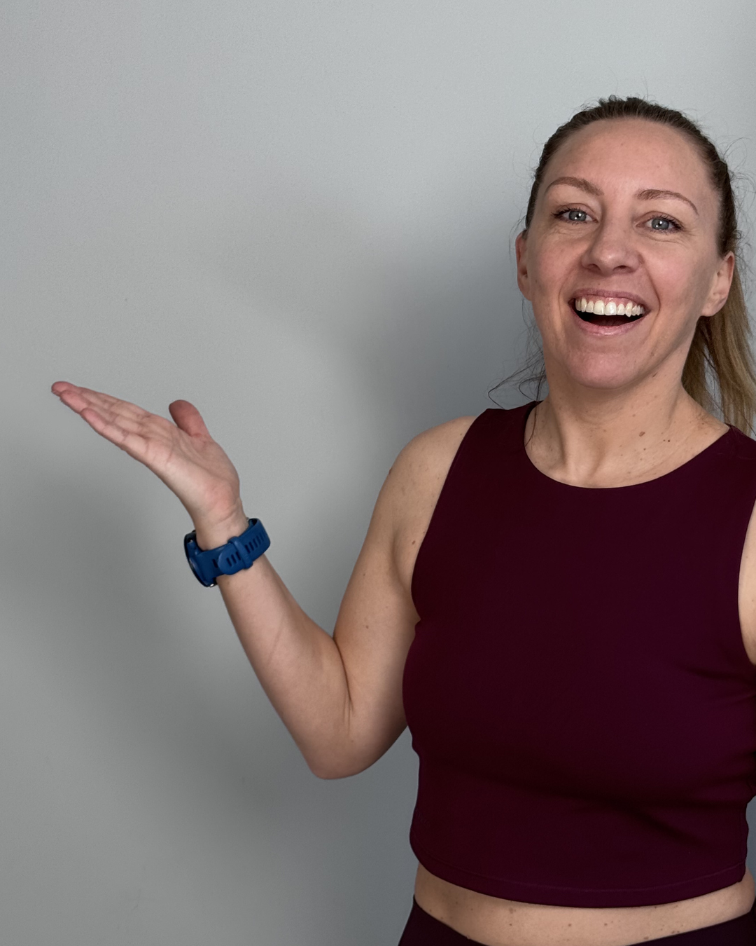 woman looking happy and pointing to the left