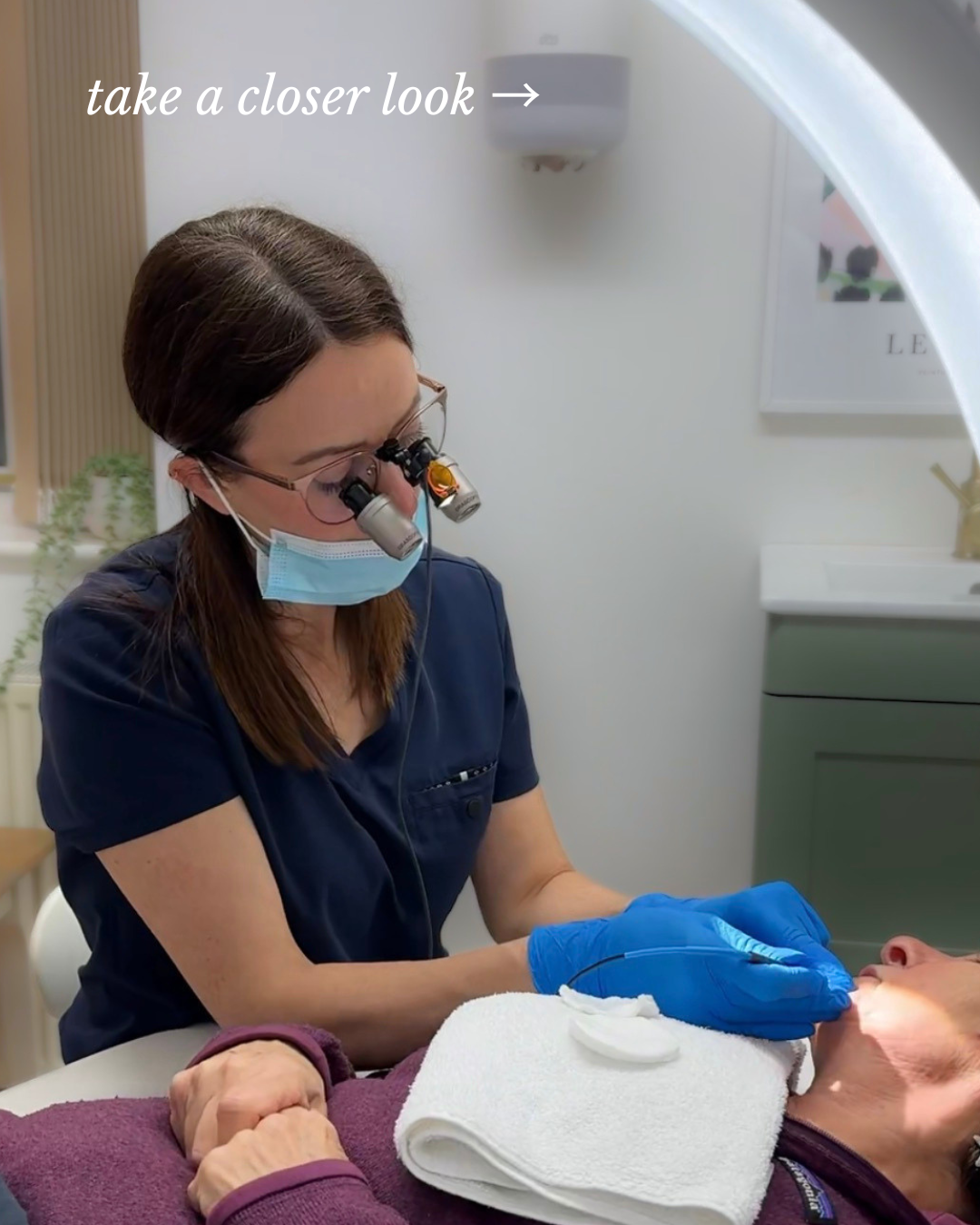 electrolysis closeup. woman with magnifying glasses performing hair removal