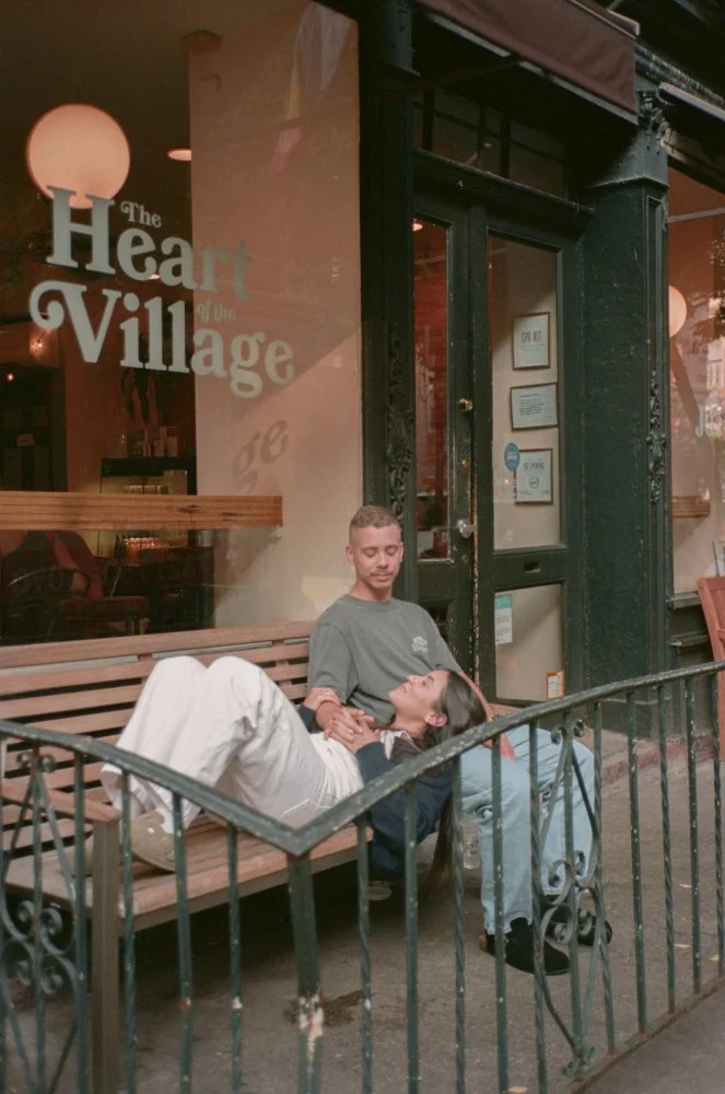 couple sitting on a bench in new york west village cafe