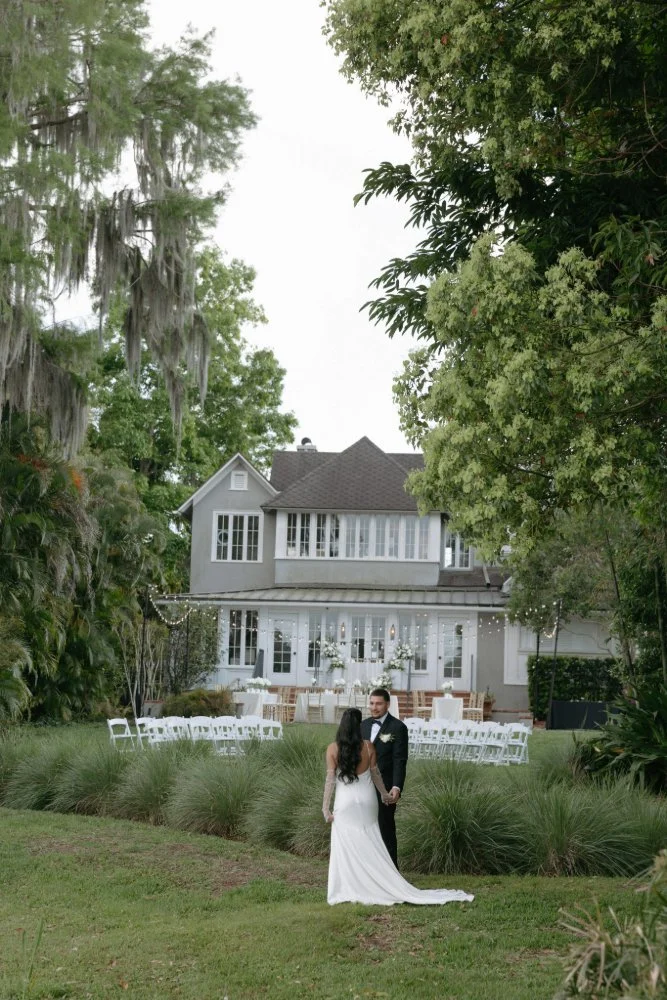 couple looking at each other at lake side wedding venue