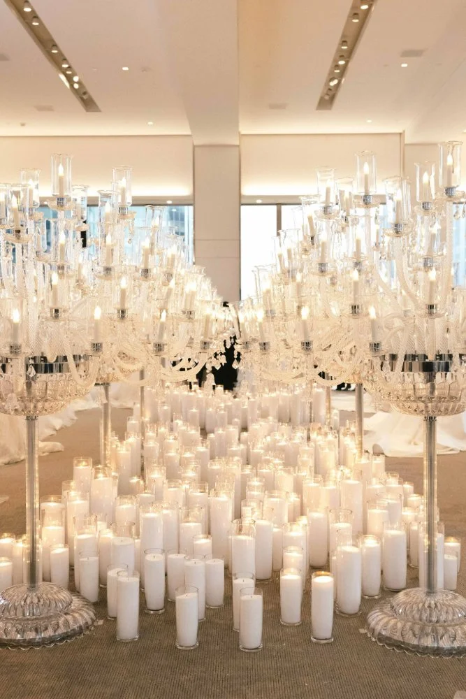 white editorial setting of candles and lights at new york city wedding fashion show