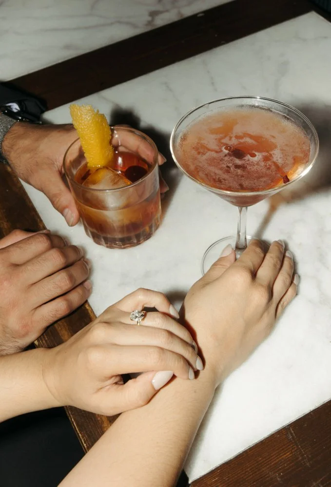 close up of couples drinks during editorial style engagement shoot
