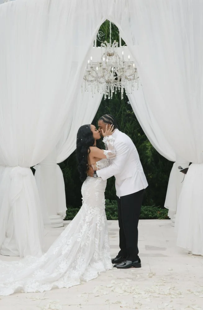 couple kissing during destination editorial style wedding