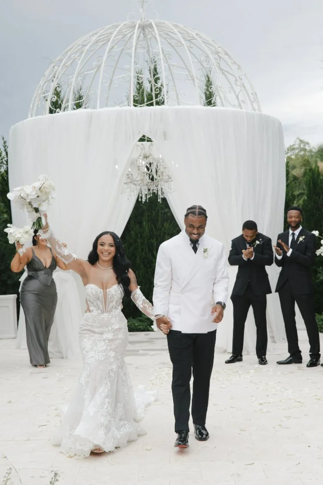 couple walking down aisle in destination wedding 