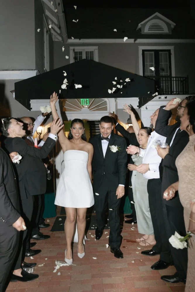 couple walking down aisle at wedding reception
