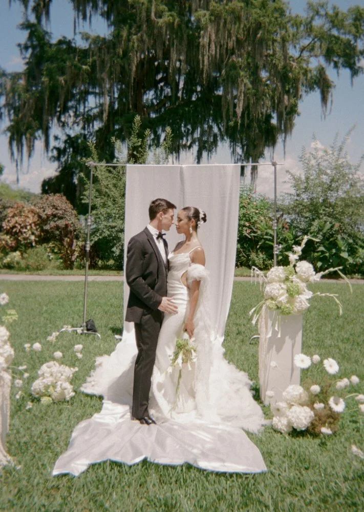 couple posing for photos at minimalistic couture styled wedding shoot