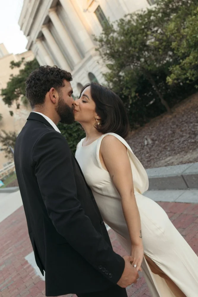 couple kissing during editorial style engagement session