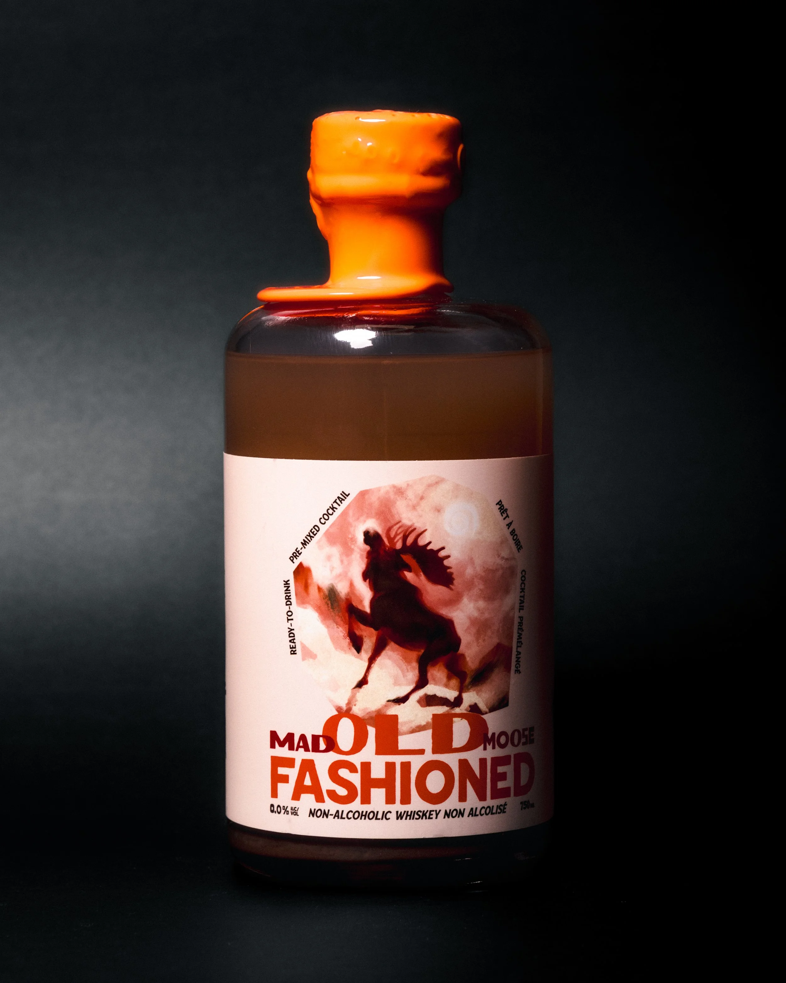 A bottle of non-alcoholic old fashioned with a black background