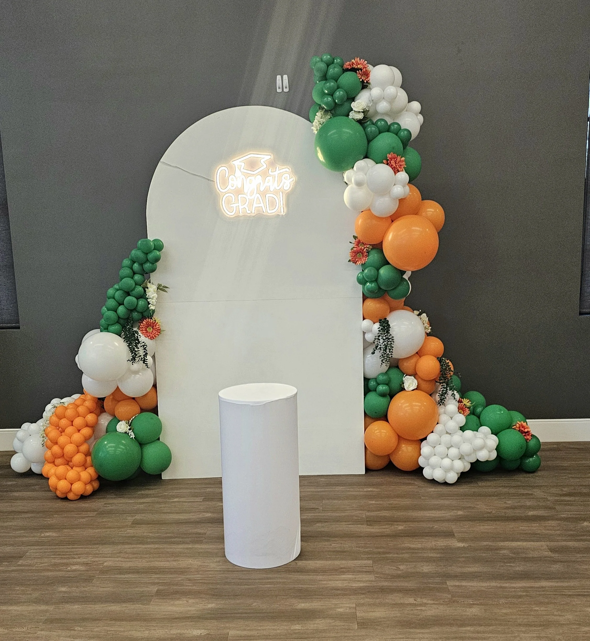 $650+ Customized Balloon Backdrop,
6 feet Wooden Panel,
15ft Balloon Garland (up to 3 colors),
Congrats Grad sign-neon, Cake Standl
Delivery, Setup, & Cleanup