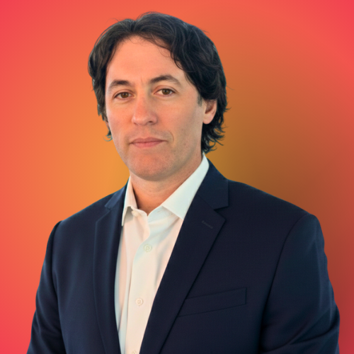 Ian Adelson headshot with orange background