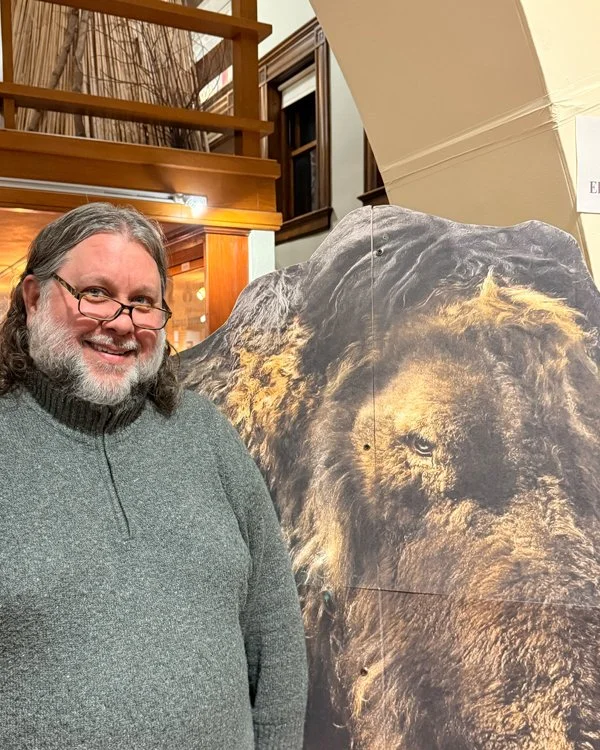 DCHS Curator Kurt Sampson next to a Mammoth cutout