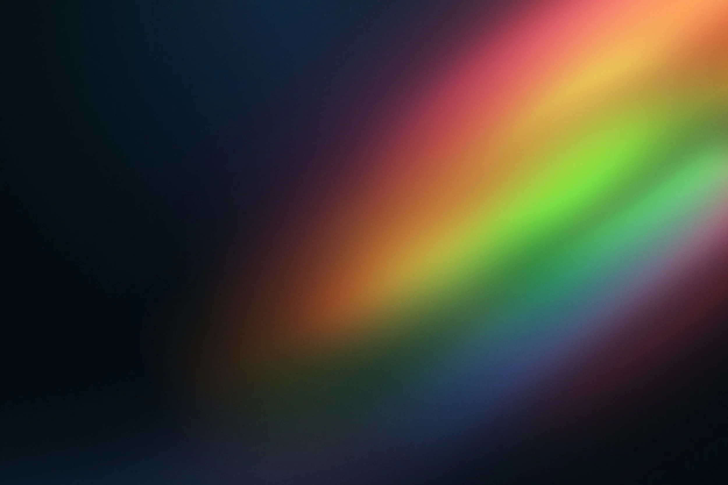 Image linking to the specialization page for LGBTQ+ issues. A blur of rainbow-colored light on a dark background.