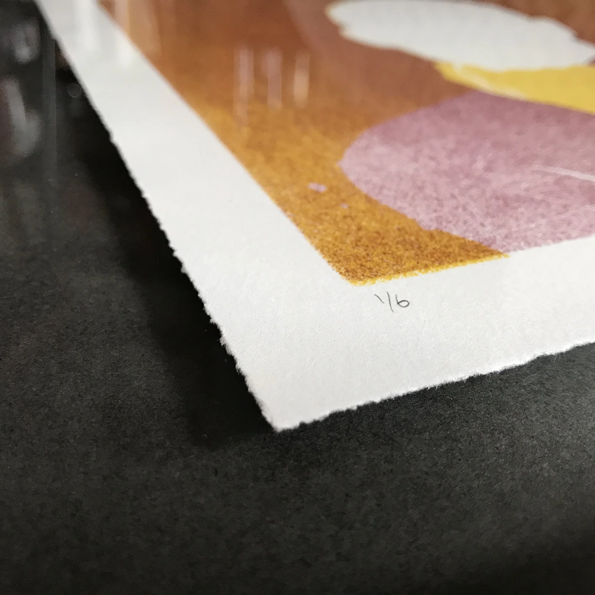 Close up of the mounting for this print in its frame.