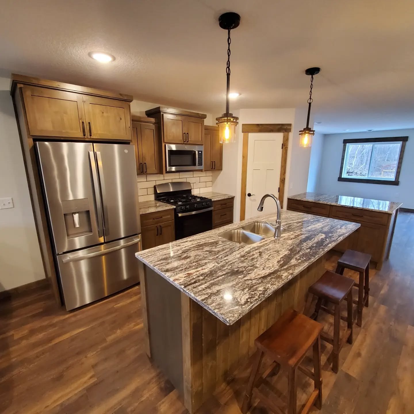 Here are the finished pictures from the post earlier. Cabinets are knotty alder with a muck brown stain, finished in a satin lacquer. I use only 6 inch pulls, it adds simplicity to an already (and intentionally) simple door design. Afterall it is a s