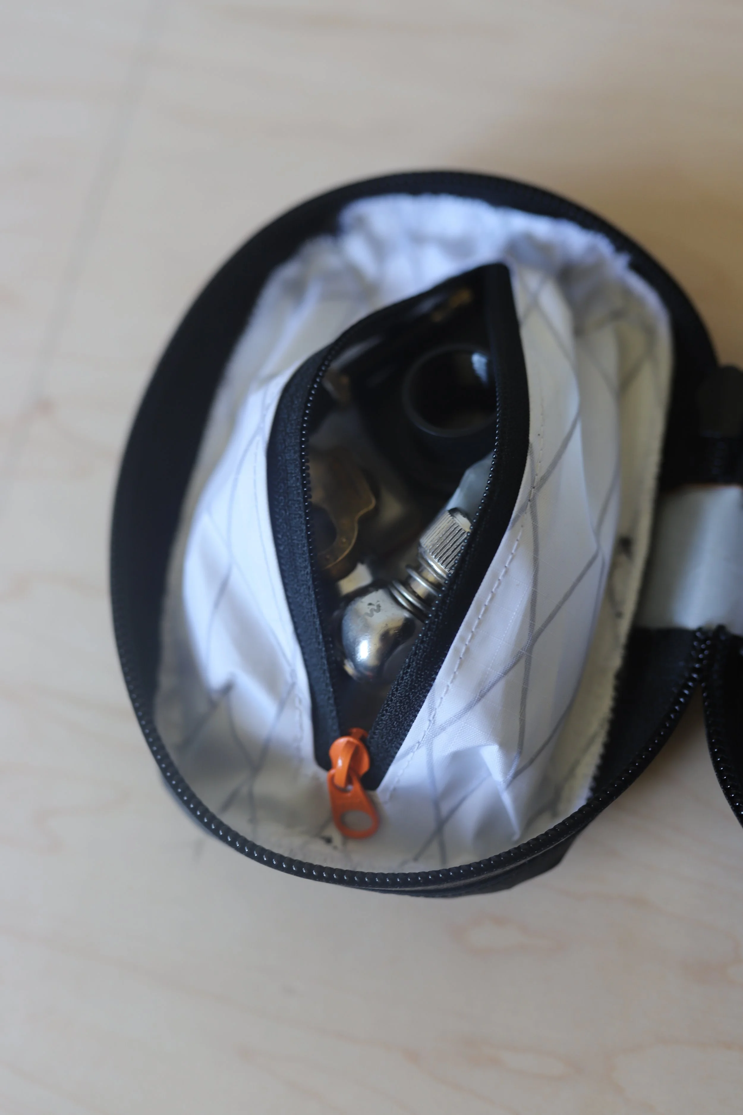 Internal zipper pocket for small parts organization