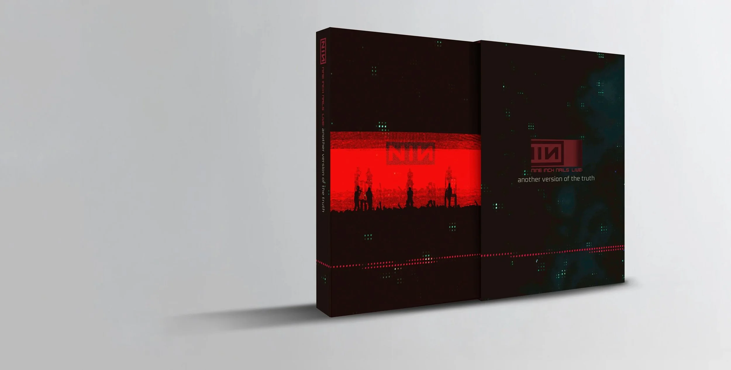 Packaging box for Nine Inch Nails live album, featuring dark digital imagery, red and black color scheme, and silhouettes of people against a textured background.