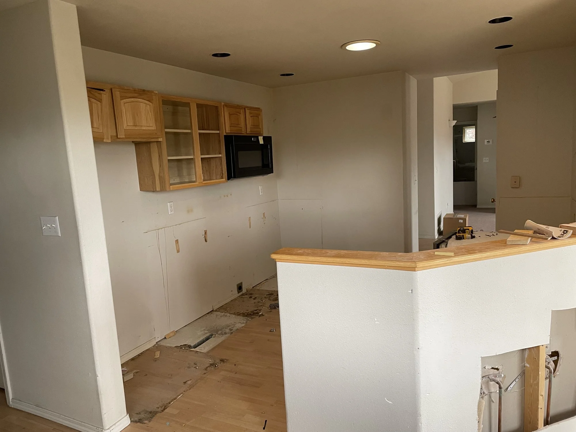 Old kitchen with oak upper cabinets before the remodel.jpg