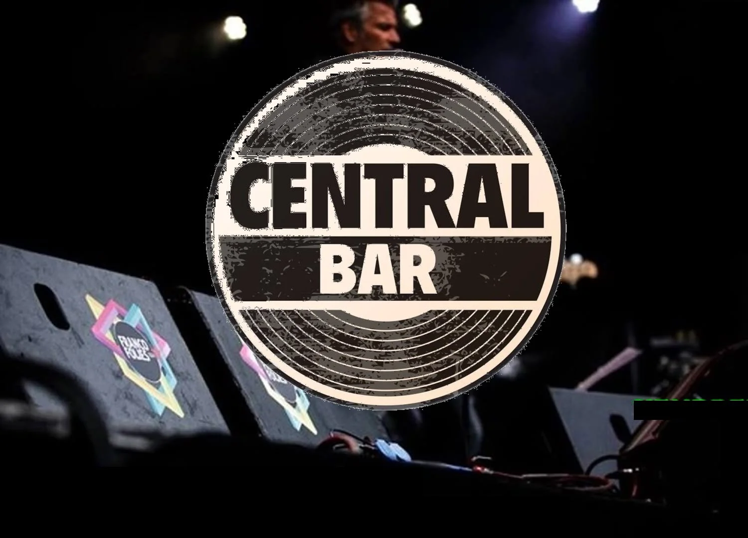 Stage with musical performers and a logo for 'Central Bar' in the foreground.