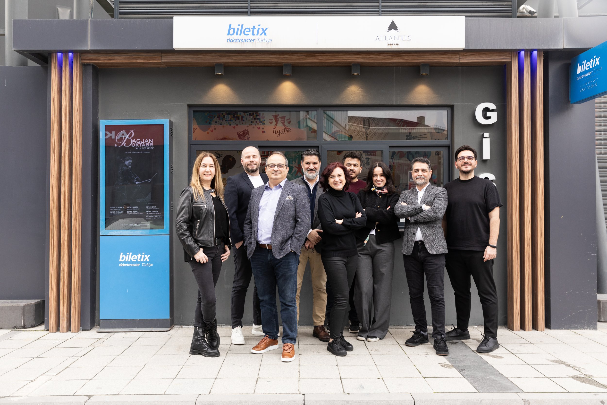 Group of people standing outside a Biletix Ticketmaster Turkey office.