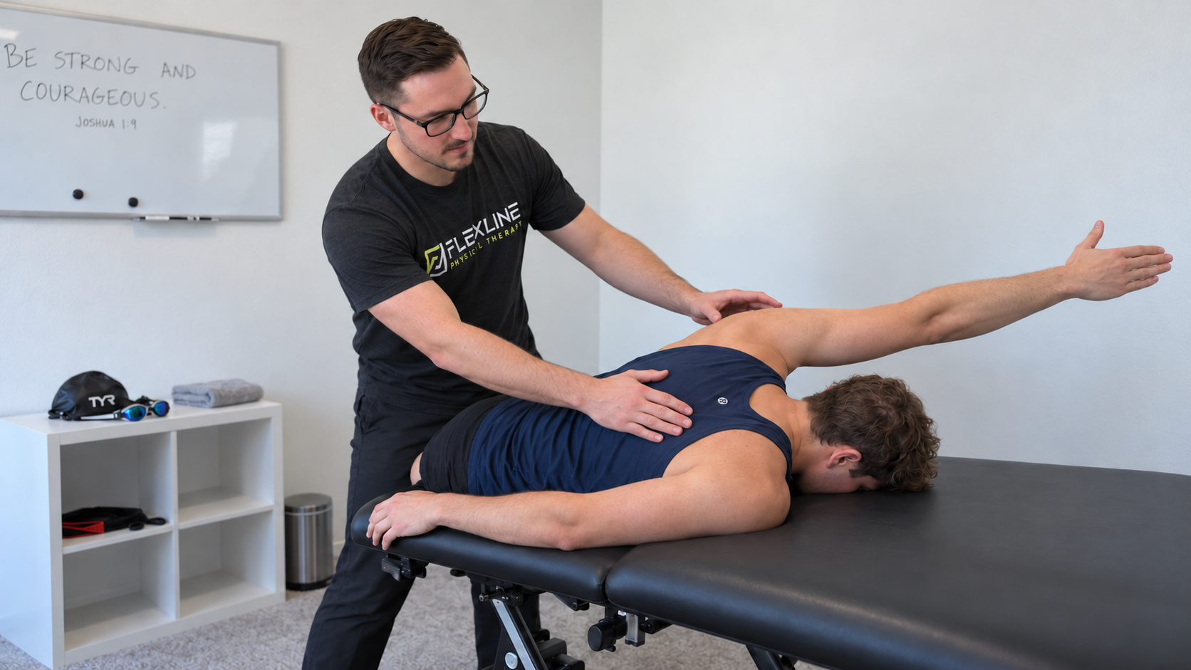 Physical therapist testing shoulder strength and stability in a patient reporting shoulder weakness