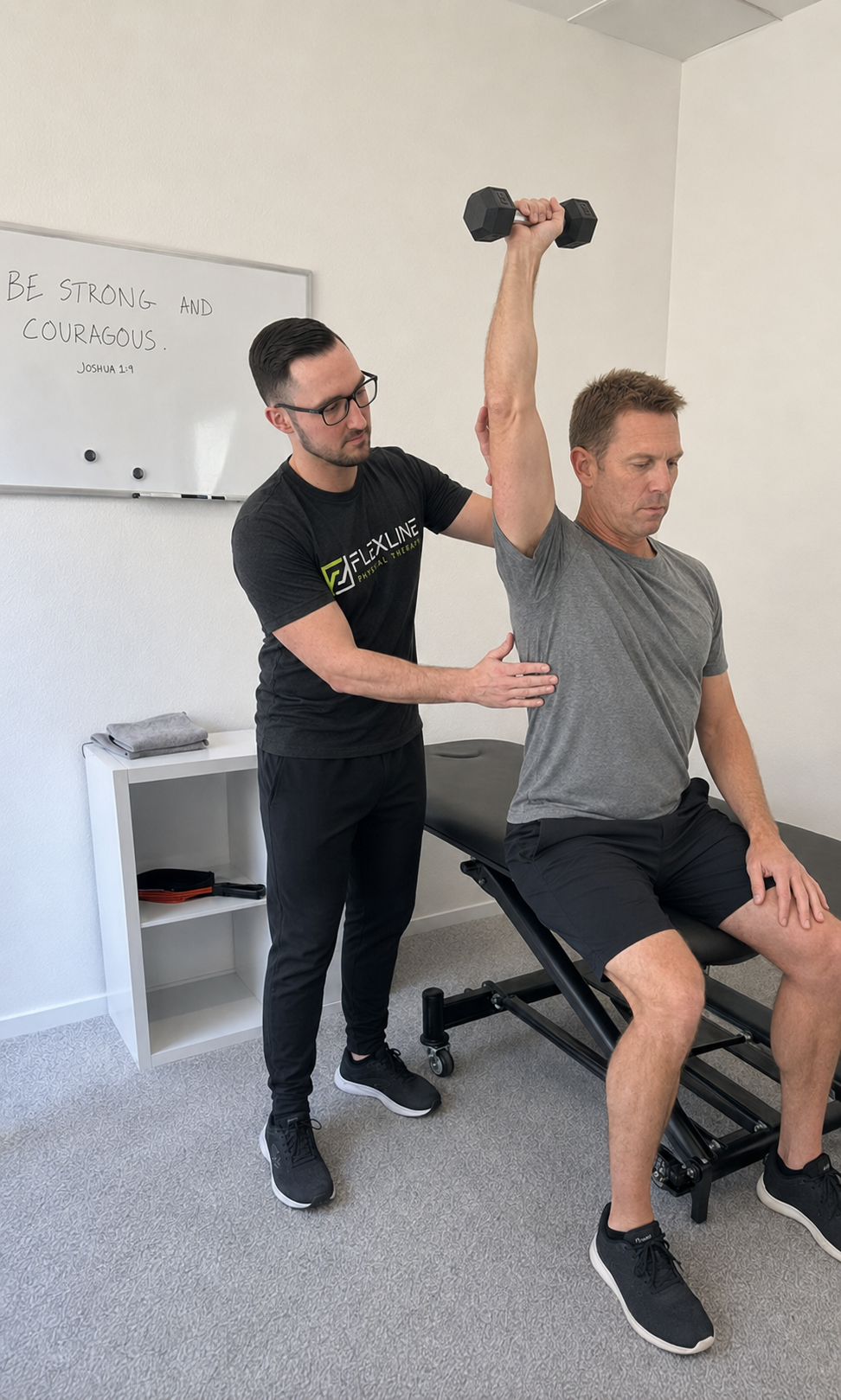 Physical therapist checking pressing technique and shoulder strength after shoulder pain from lifting weights