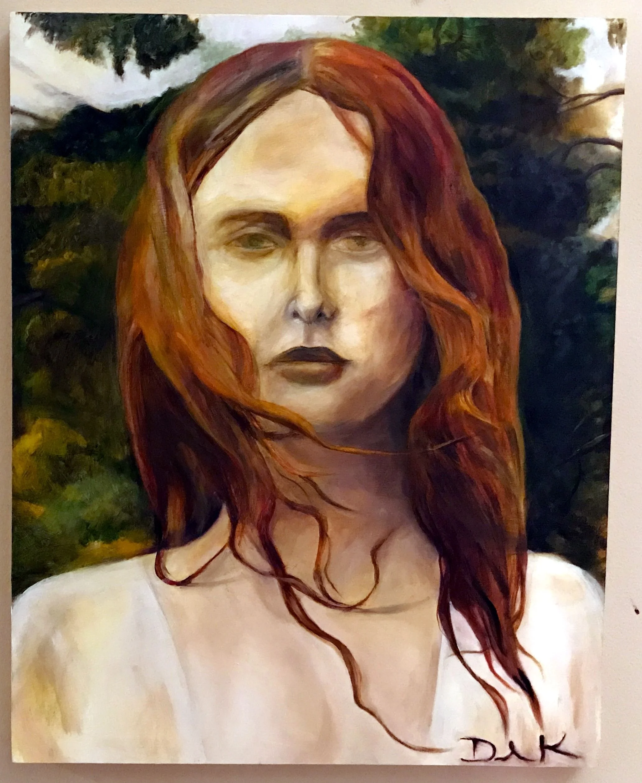 A painting of a woman with long, wavy red hair and a serious expression, set against a background of dark green foliage.