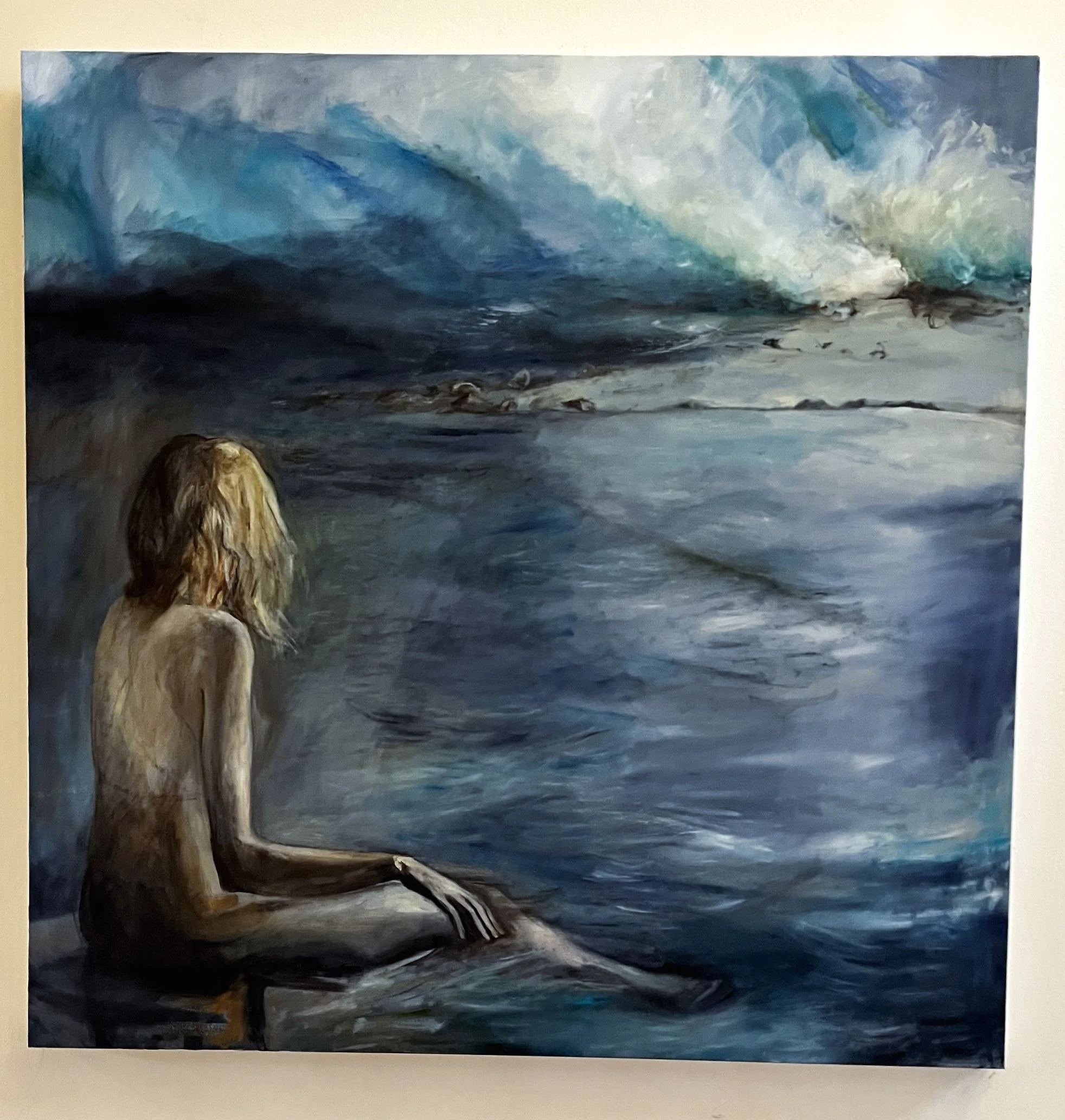 A painting of a nude woman with blonde hair, sitting by the ocean, looking at the waves