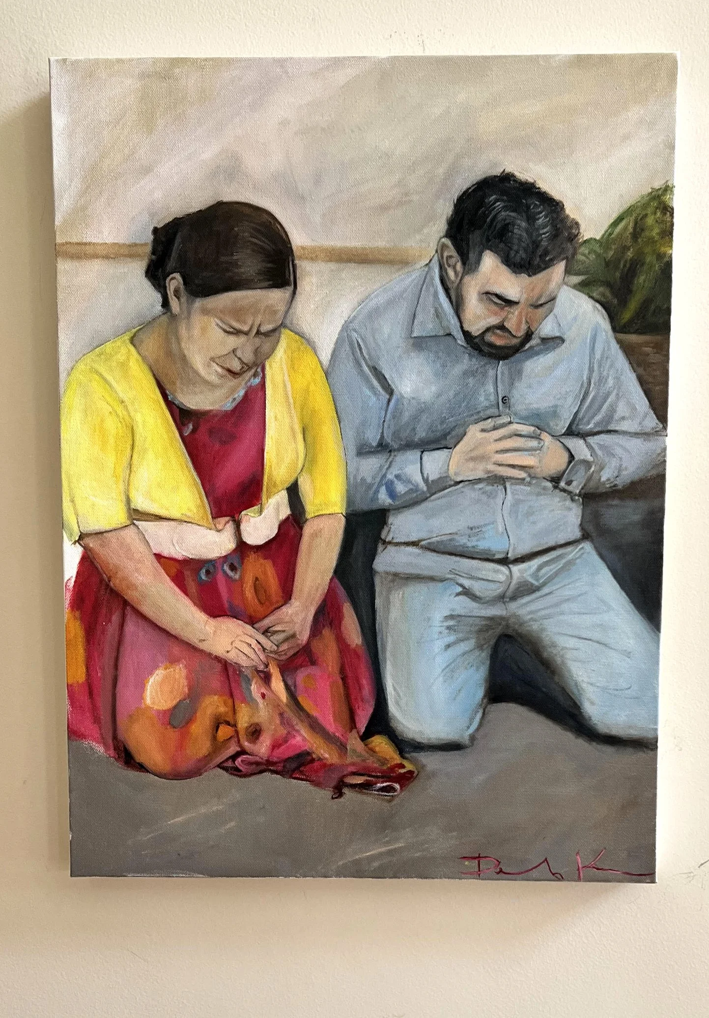 Painting of a man and woman kneeling with heads bowed in prayer.