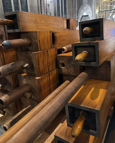 A stack of Opus 414’s wooden pipes, chosen for their dark, soft sound, are readied for shipping to Schantz Organ Company for repair.
