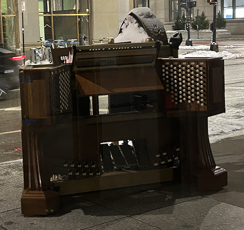 The previous console of Opus 414 waiting for pickup outside the Chicago Temple on LaSalle Street.
