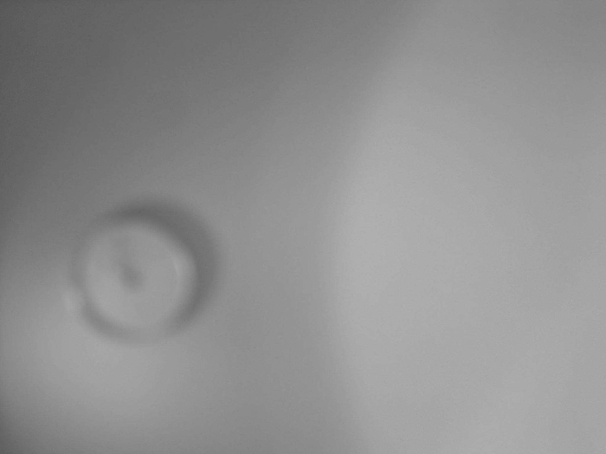 TITLE:  Blurry clock on a wall;  Blurry means don't hurry and don't worry