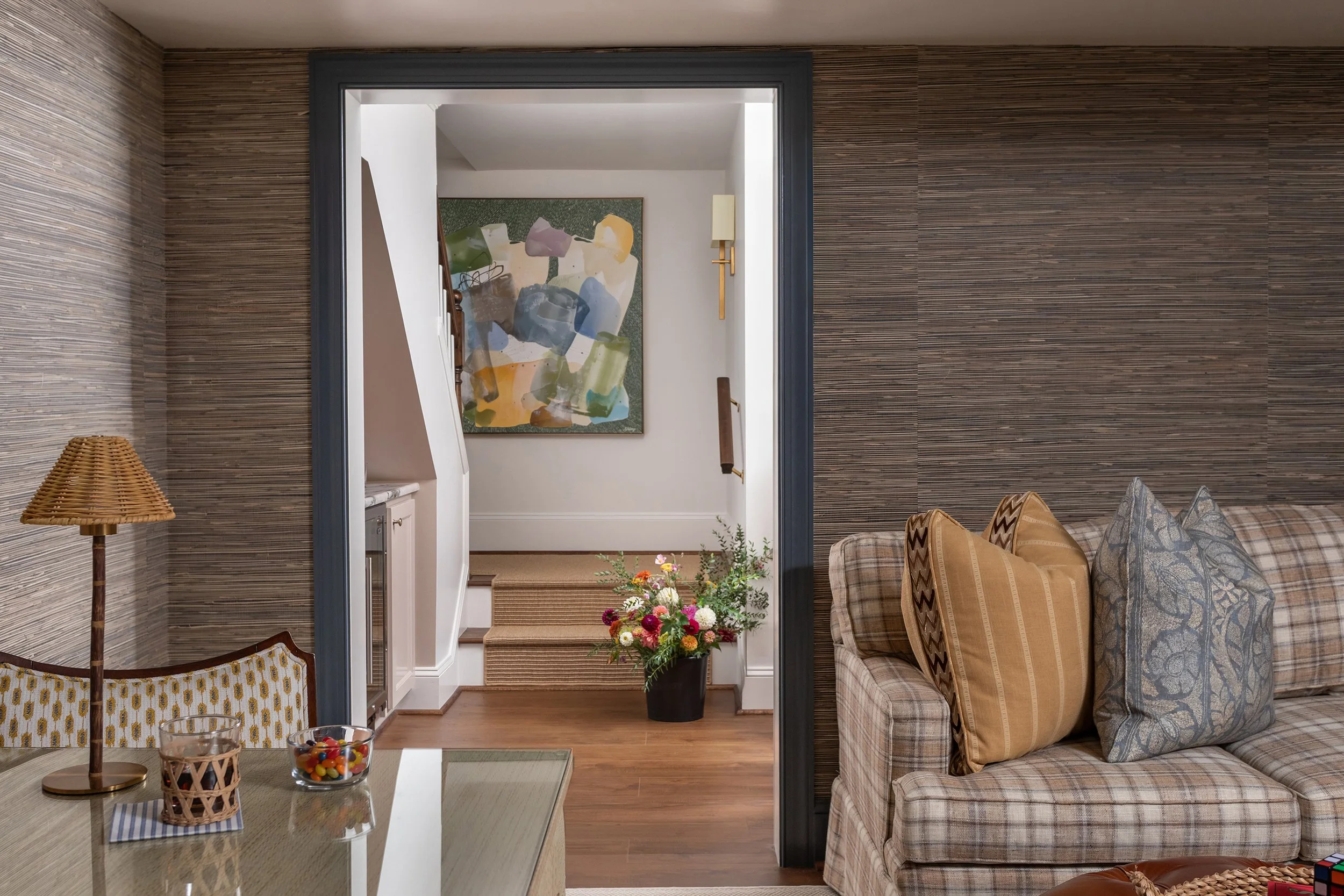 Bonus room basement with custom wall covering and furnishings 