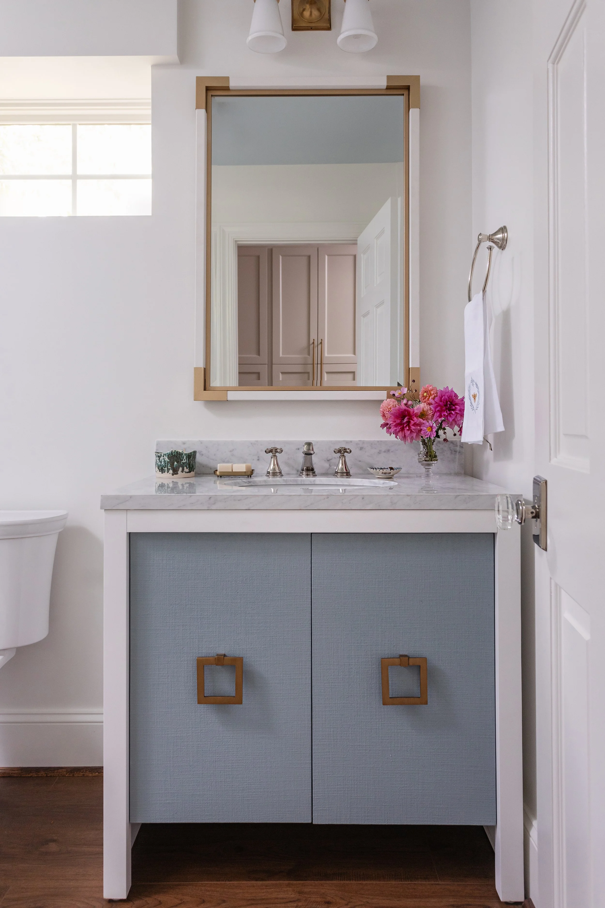Custom cabinetry and design details for a basement bathroom 