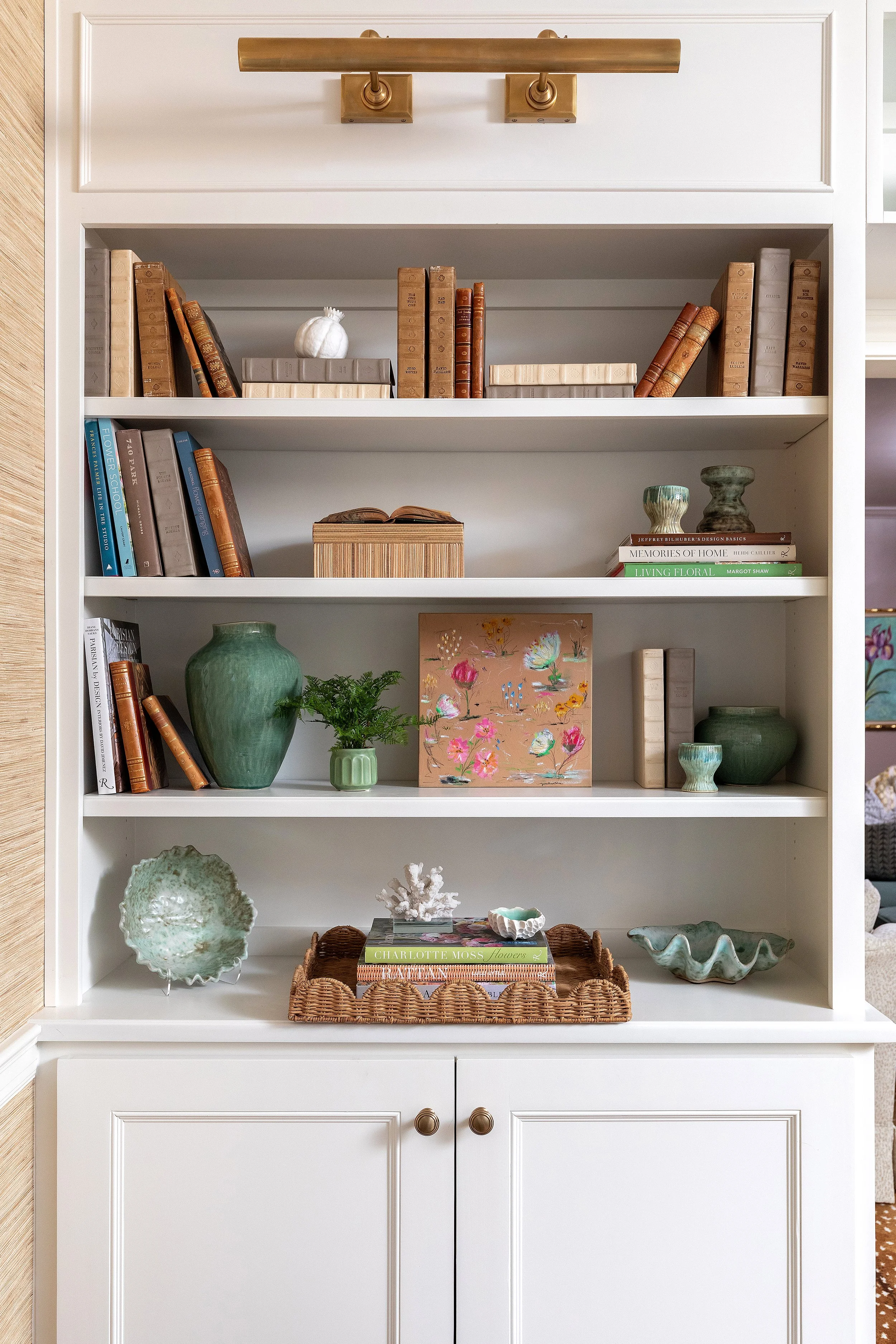 Shelving decor and styling for living area by NC interior designer Martha Midgette